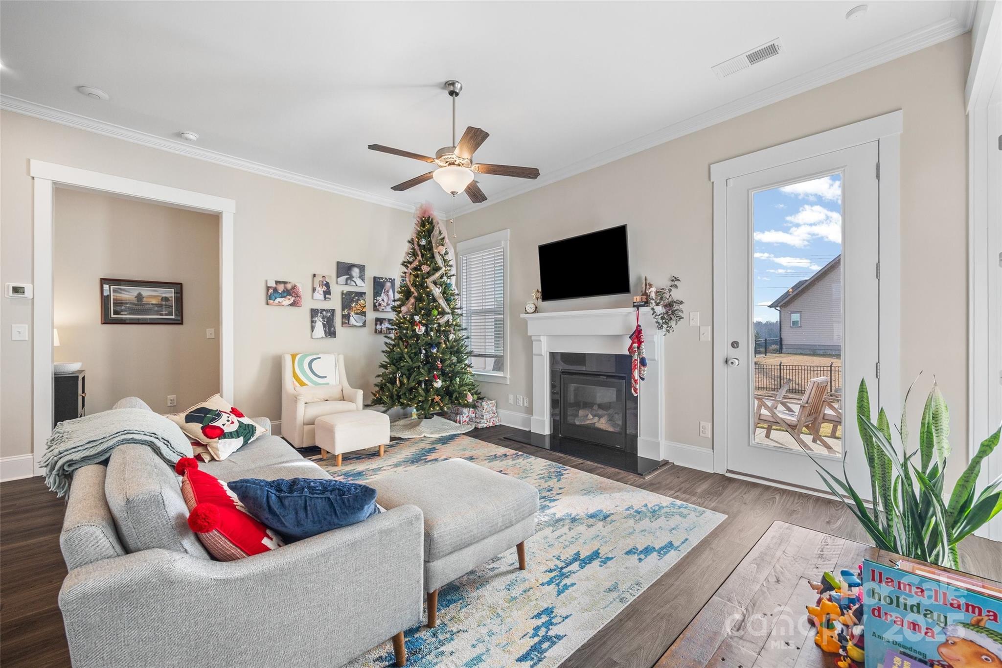 280 Auburn View Road Rock Hill, SC 29730 - Photo 4 of 48 a living room with furniture a fireplace and a flat screen tv