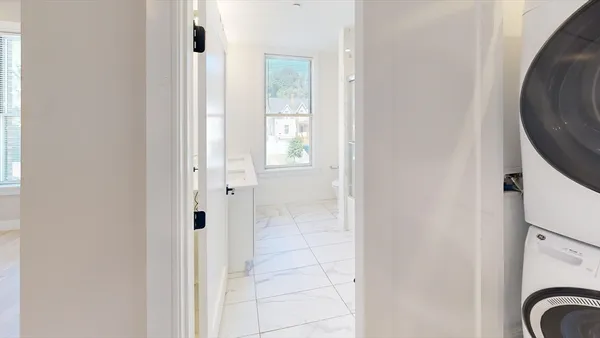 a view of a bathroom with mirror