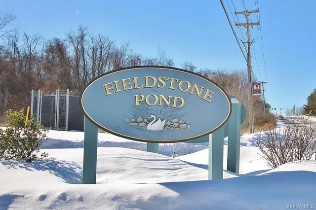 a sign on a pole on a street