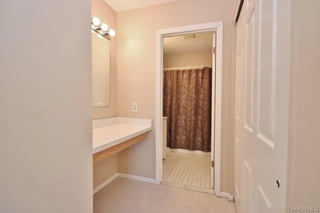 a bathroom with a tub and shower