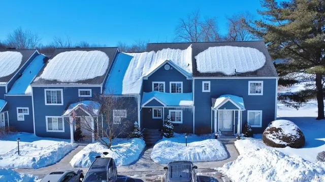 a front view of a house with seating space