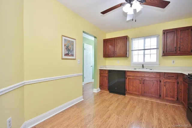 a kitchen with a refrigerator and a sink