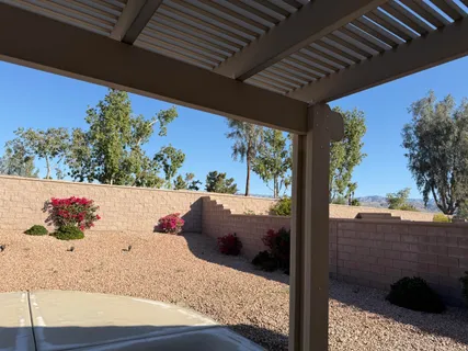 a view of balcony with furniture