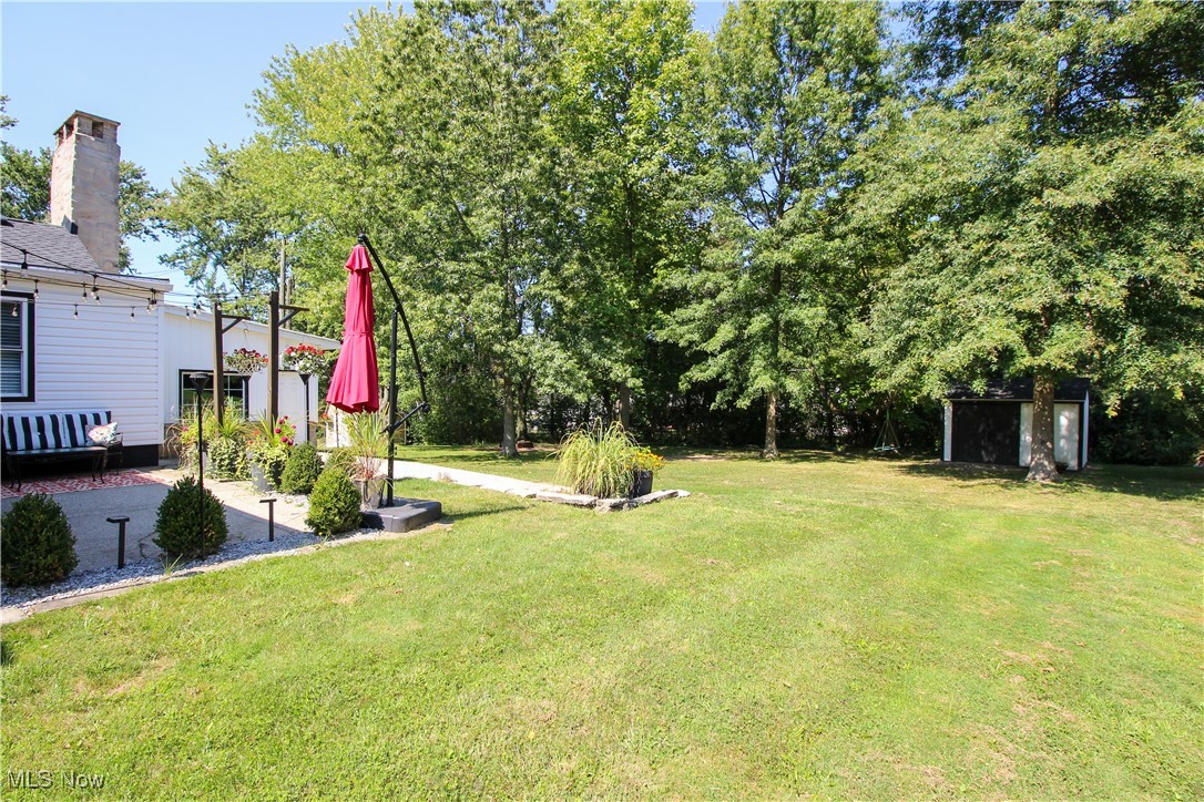 207 Harmon Road Aurora, OH 44202 - Photo 38 of 40 View patio area, side yard with a shed.