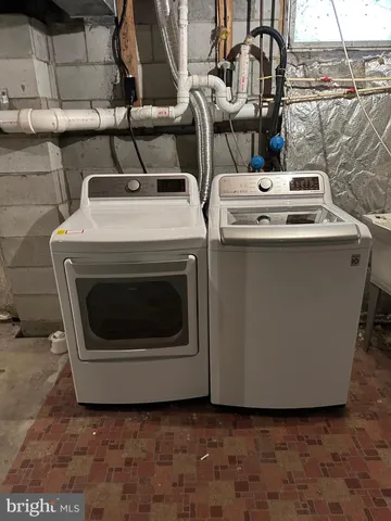 a white stove top oven sitting inside of a kitchen