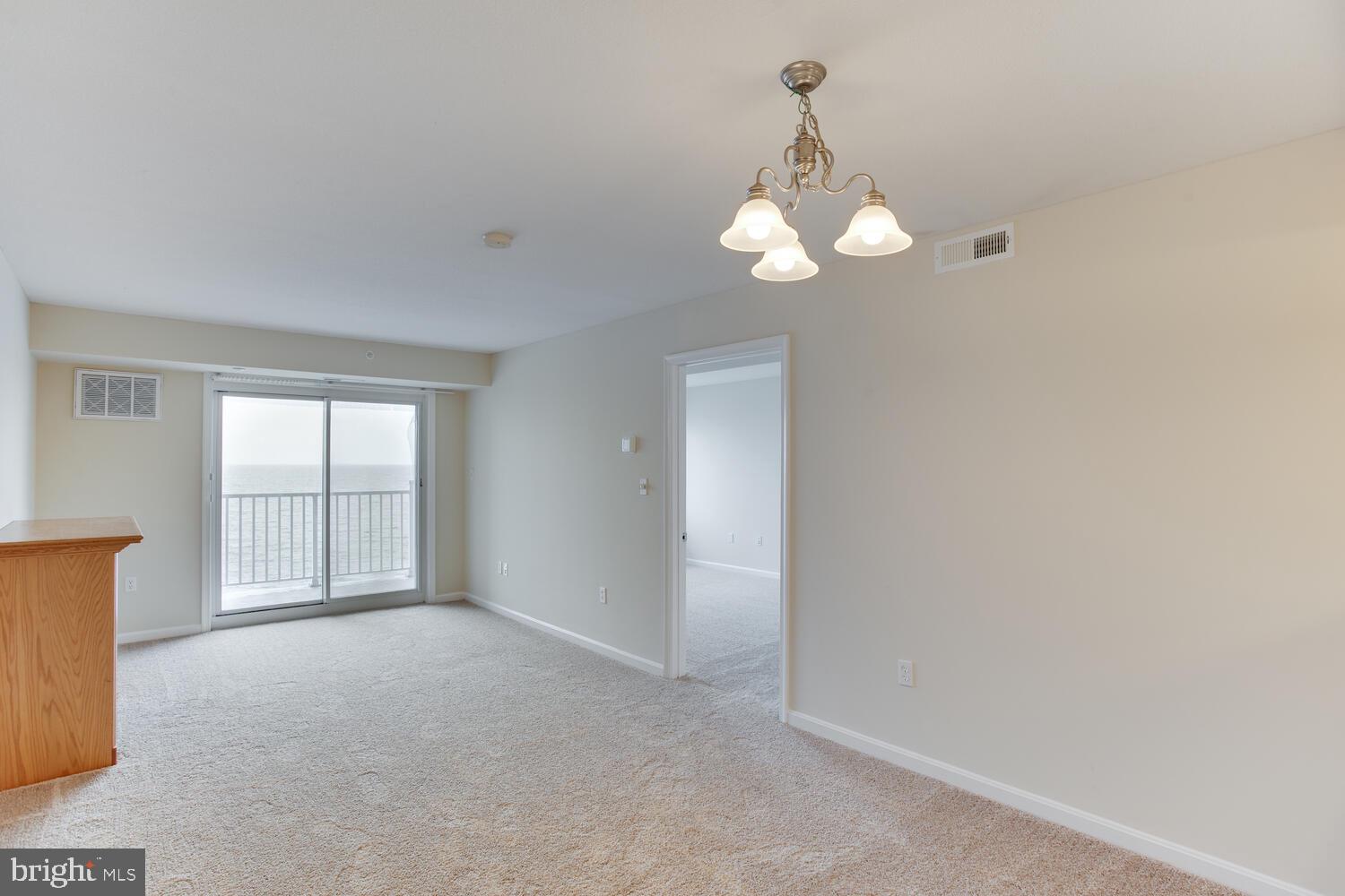 8501 Bayside Road, Unit 408 Chesapeake Beach, MD 20732 - Photo 12 of 34 Great room with views of the Bay.