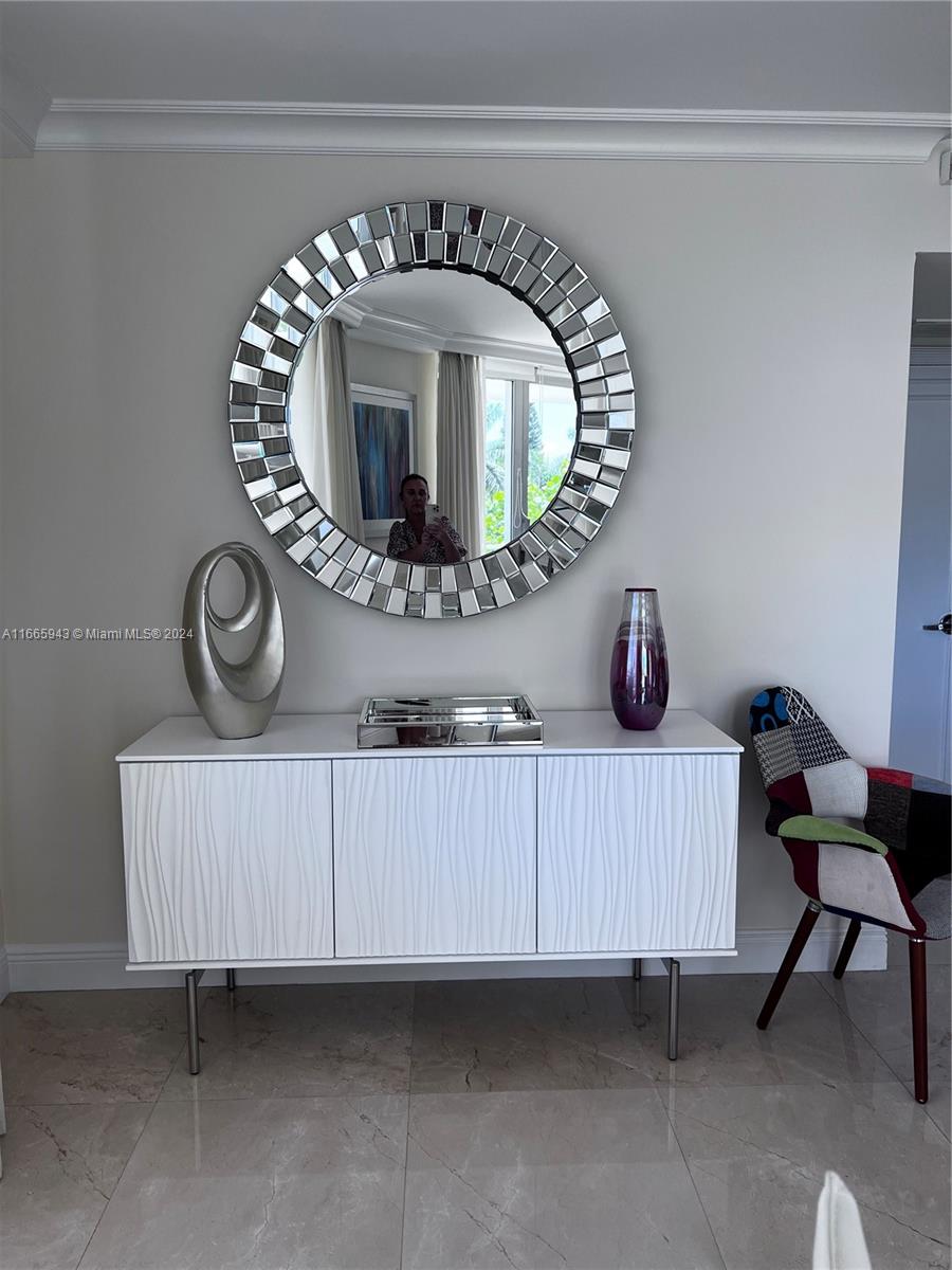 5161 Collins Avenue, Unit 505 Miami Beach, FL 33140 - Photo 16 of 31 a view of a room with baby toys and wooden floor