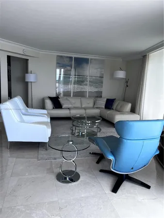 a kitchen with kitchen island granite countertop a sink stove and microwave