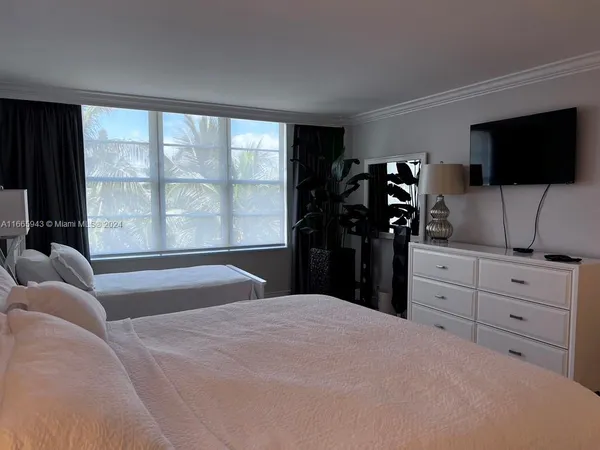 a bathroom with a shower and a sink