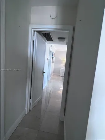 a bedroom with a bed and lamp