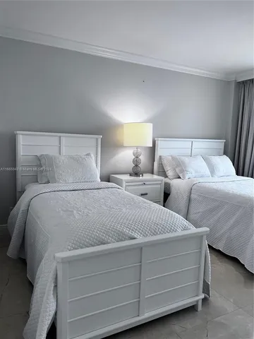 a bathroom with a toilet a sink and shower