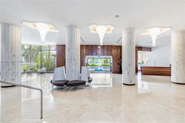 a balcony with lots of green space and plants in the back