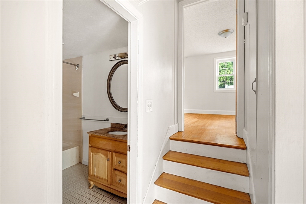 27 Columbia Road Marblehead, MA 01945 - Photo 15 of 30 a bedroom with a bed and a window