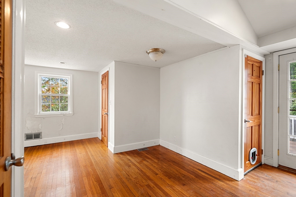 27 Columbia Road Marblehead, MA 01945 - Photo 23 of 30 an empty room with wooden floor and windows