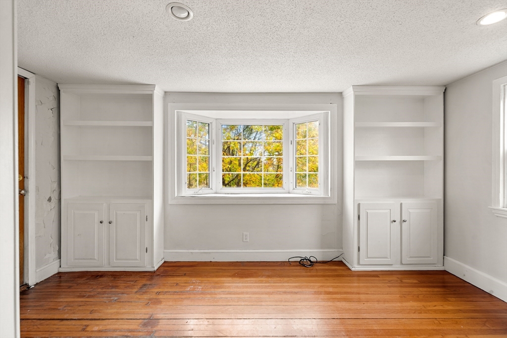27 Columbia Road Marblehead, MA 01945 - Photo 5 of 30 a view of empty room with wooden floor and fan