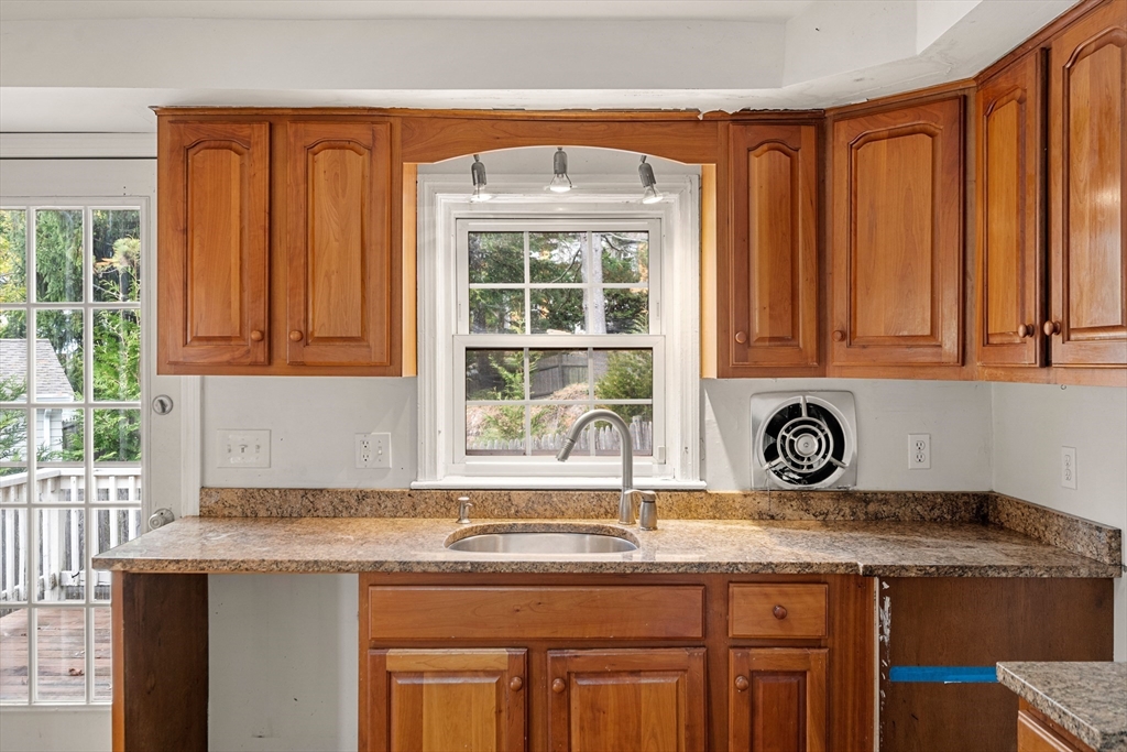 27 Columbia Road Marblehead, MA 01945 - Photo 7 of 30 a kitchen with granite countertop a sink window and cabinets