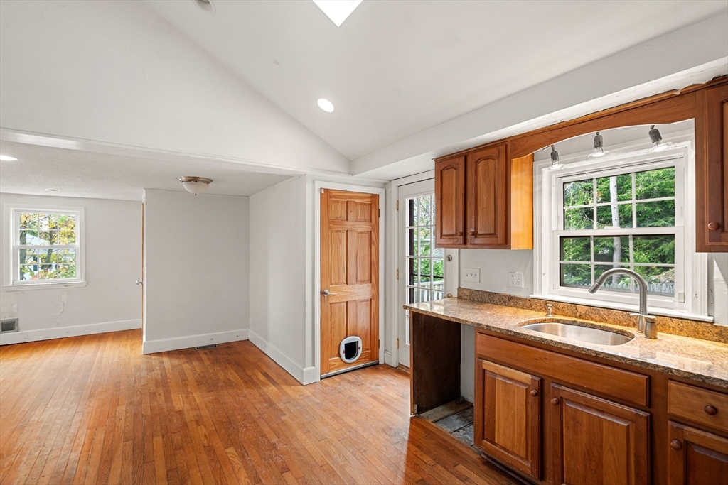 27 Columbia Road Marblehead, MA 01945 - Photo 9 of 30 a kitchen with a sink and wooden cabinets