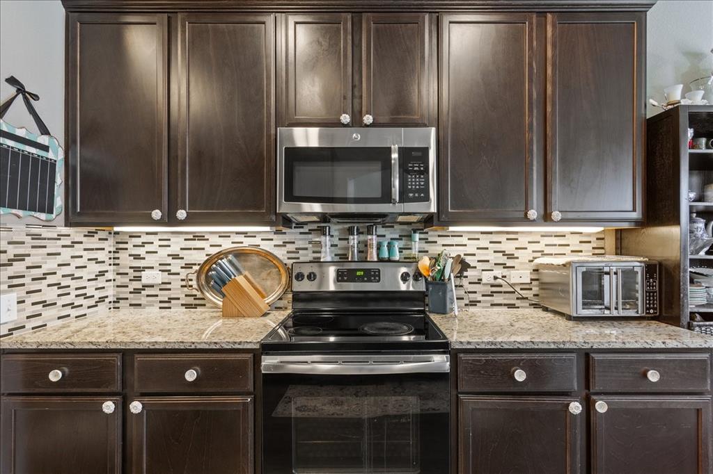 10205 Mickler Lane Waco, TX 76708 - Photo 12 of 35 a stove top oven sitting inside of a kitchen
