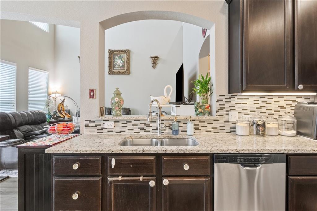10205 Mickler Lane Waco, TX 76708 - Photo 14 of 35 a bathroom with a granite countertop sink a mirror and vanity