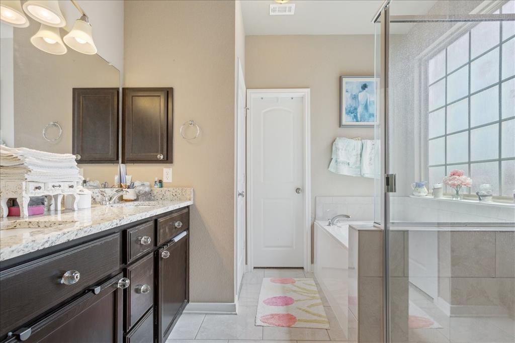 10205 Mickler Lane Waco, TX 76708 - Photo 17 of 35 a bathroom with a sink and a mirror