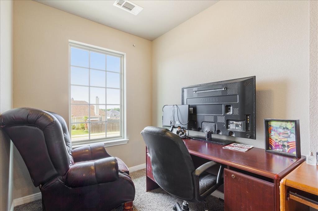 10205 Mickler Lane Waco, TX 76708 - Photo 23 of 35 a work room with furniture and windows