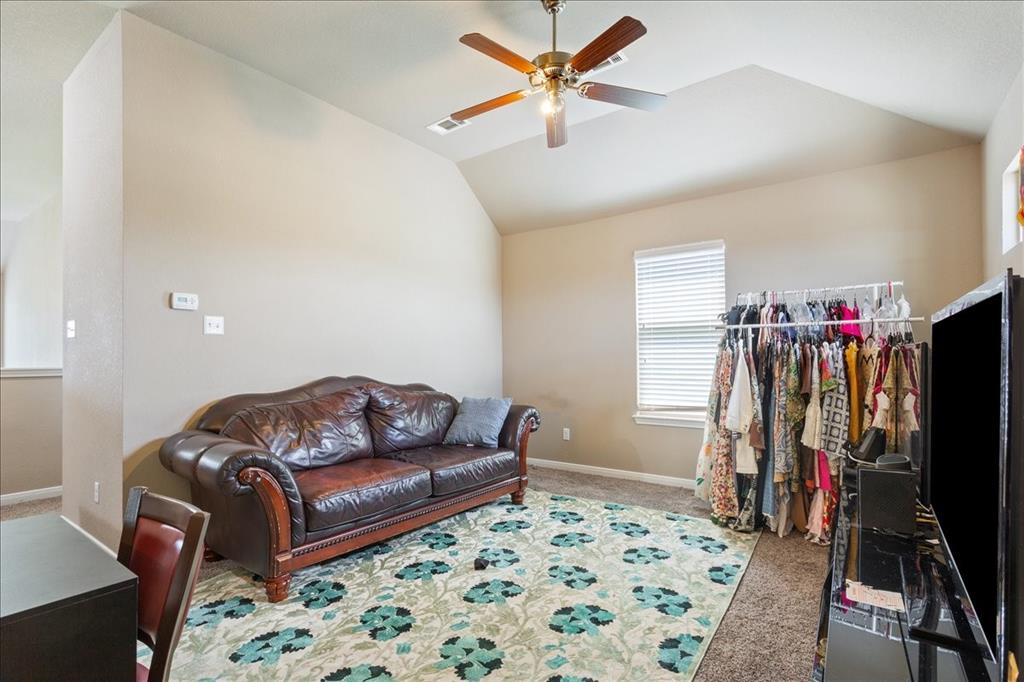 10205 Mickler Lane Waco, TX 76708 - Photo 25 of 35 a living room with furniture and a flat screen tv