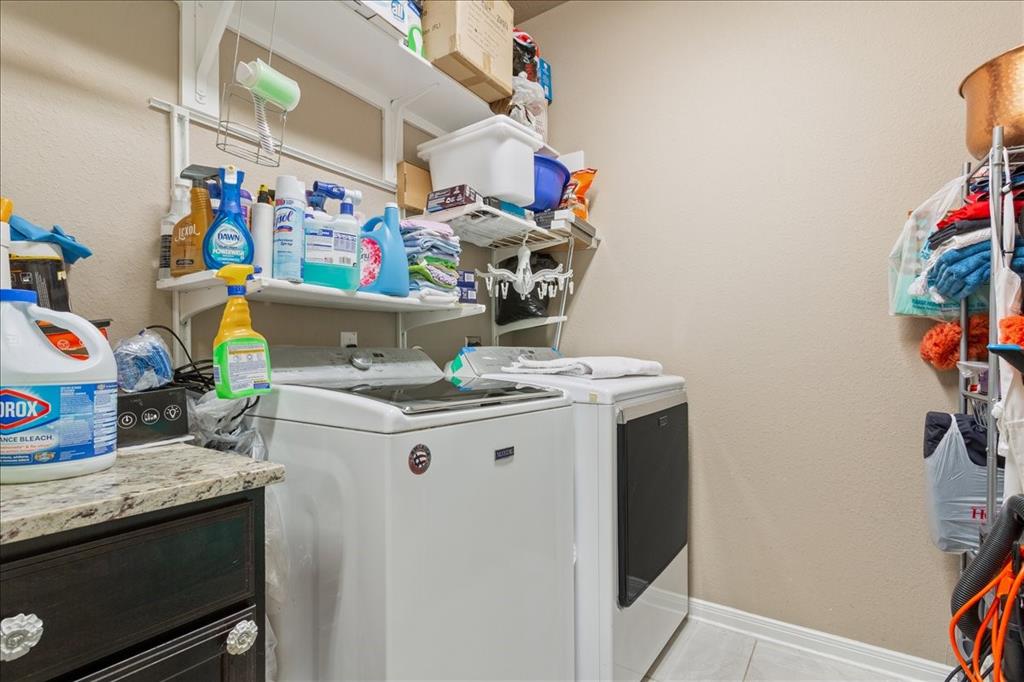 10205 Mickler Lane Waco, TX 76708 - Photo 27 of 35 a storage room with washer and dryer