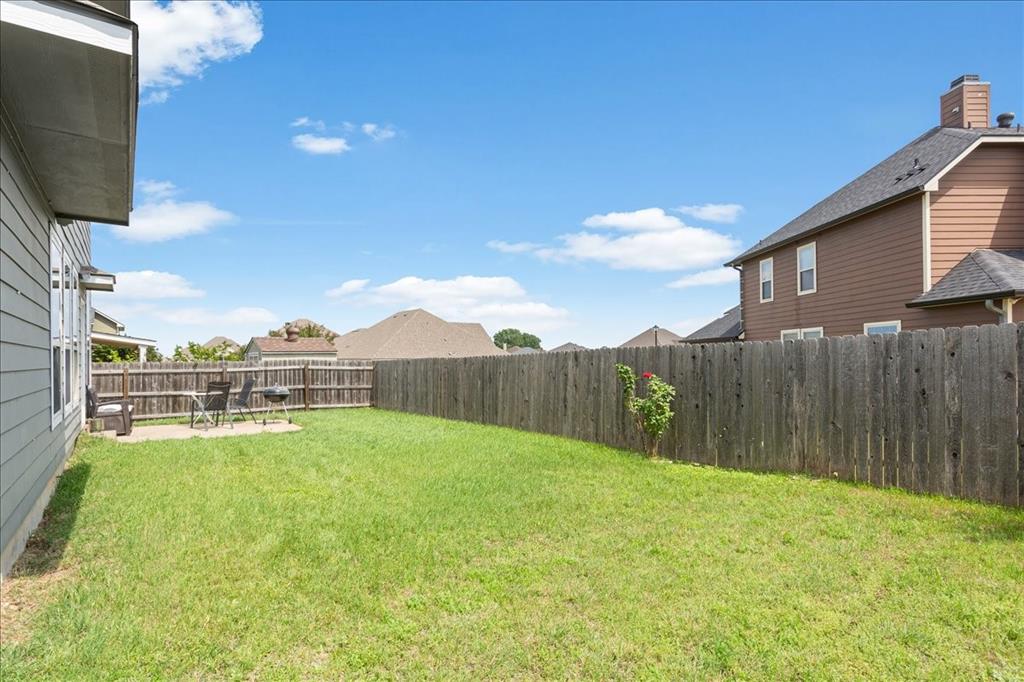 10205 Mickler Lane Waco, TX 76708 - Photo 30 of 35 a view of a backyard with a garden