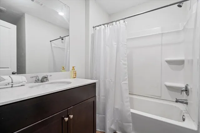 a bathroom with a bathtub and a sink