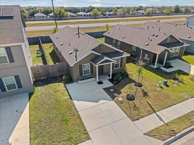 an aerial view of a house with a ocean view