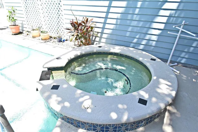 an aerial view of residential houses with outdoor space and street view