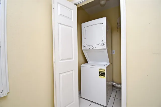 a front view of a building with a garden