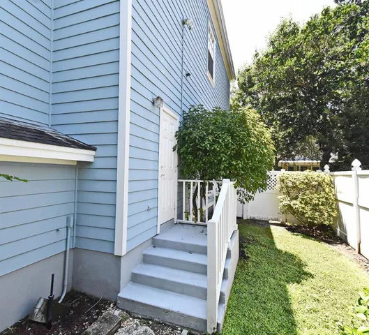 a view of backyard with a slide and table