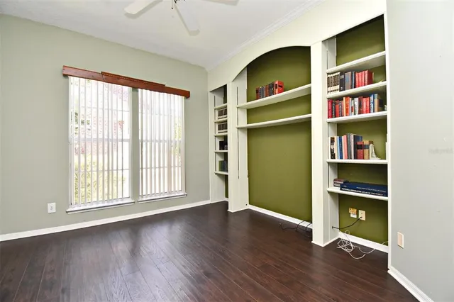 a bathroom with a granite countertop sink a mirror and a shower