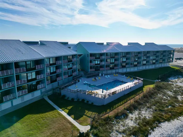 a view of a swimming pool with a garden
