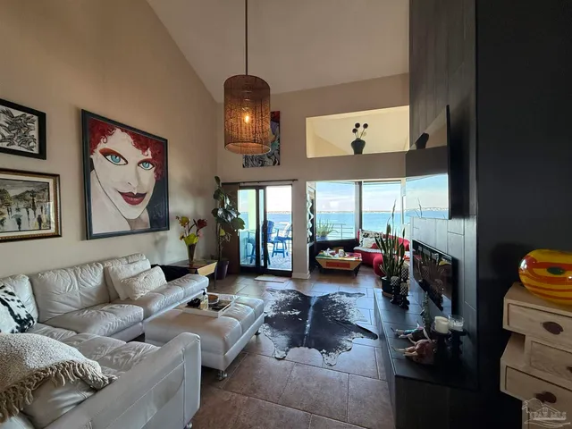 a living room with furniture fireplace and window