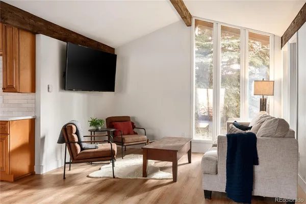 a living room with furniture and a window