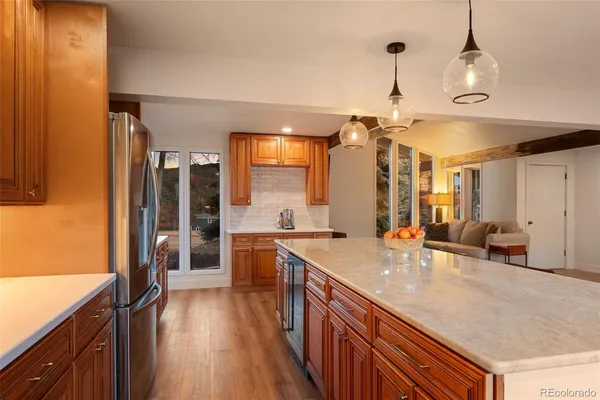 a spacious bathroom with a granite countertop sink and a bathtub