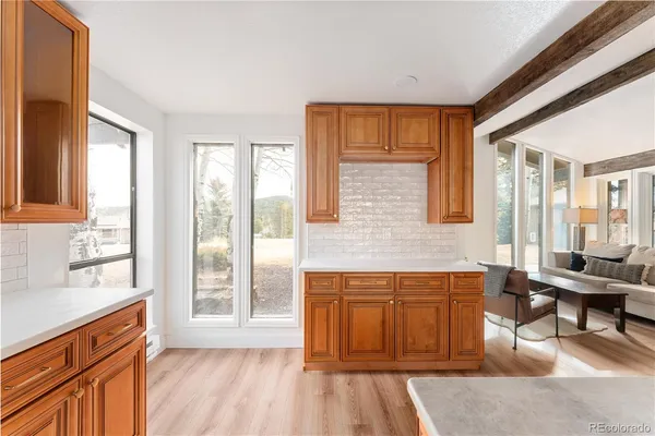 a kitchen that has a sink and a stove