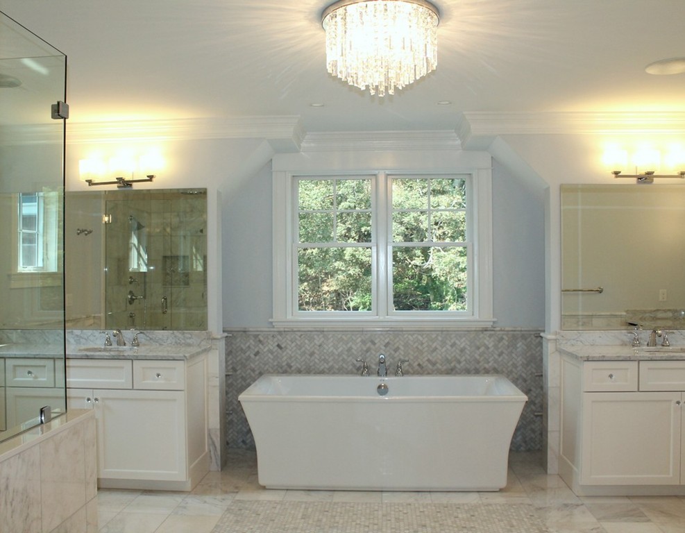 8 Burnham Road Lexington, MA 02420 - Photo 15 of 22 a bathroom with a large tub a sink a window and a shower