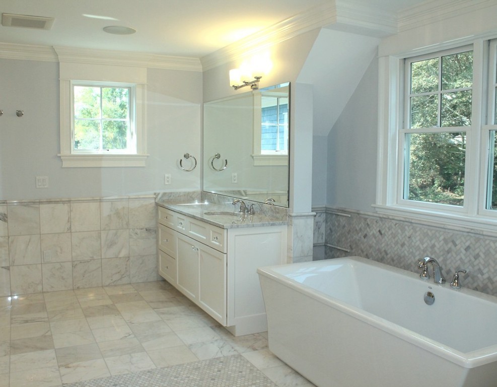 8 Burnham Road Lexington, MA 02420 - Photo 17 of 22 a bathroom with a granite countertop bathtub a sink and a window