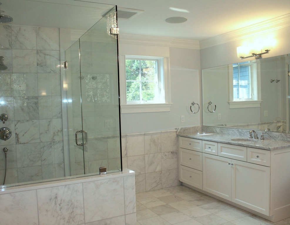 8 Burnham Road Lexington, MA 02420 - Photo 19 of 22 a bathroom with a granite countertop sink a shower and mirror