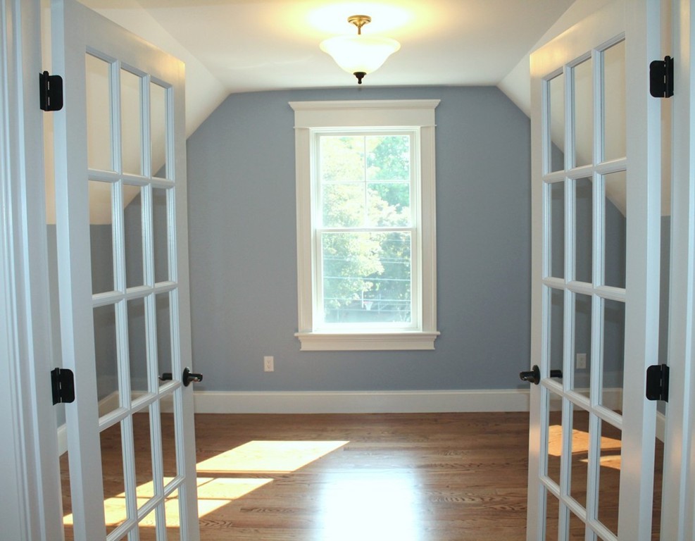 8 Burnham Road Lexington, MA 02420 - Photo 20 of 22 a view of entryway with wooden floor and front door