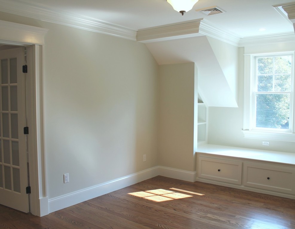 8 Burnham Road Lexington, MA 02420 - Photo 21 of 22 an empty room with wooden floor and cabinet