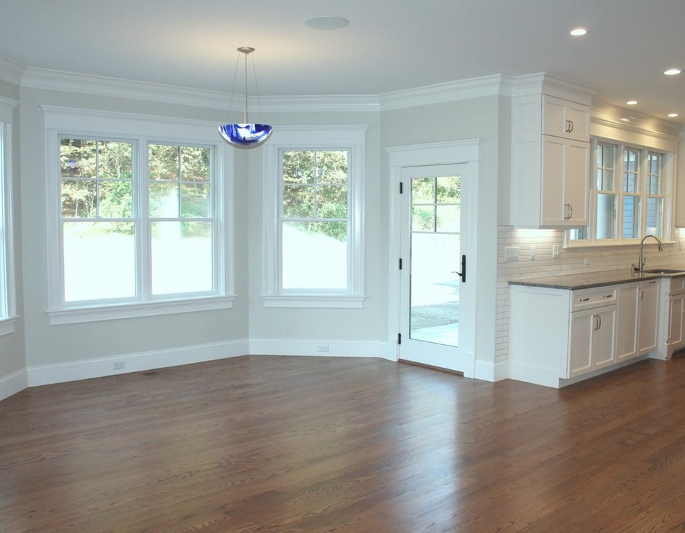 8 Burnham Road Lexington, MA 02420 - Photo 5 of 22 a view of an empty room with wooden floor and a window
