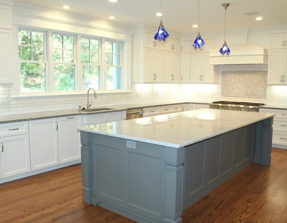 8 Burnham Road Lexington, MA 02420 - Photo 7 of 22 a kitchen with stainless steel appliances granite countertop a sink and a stove
