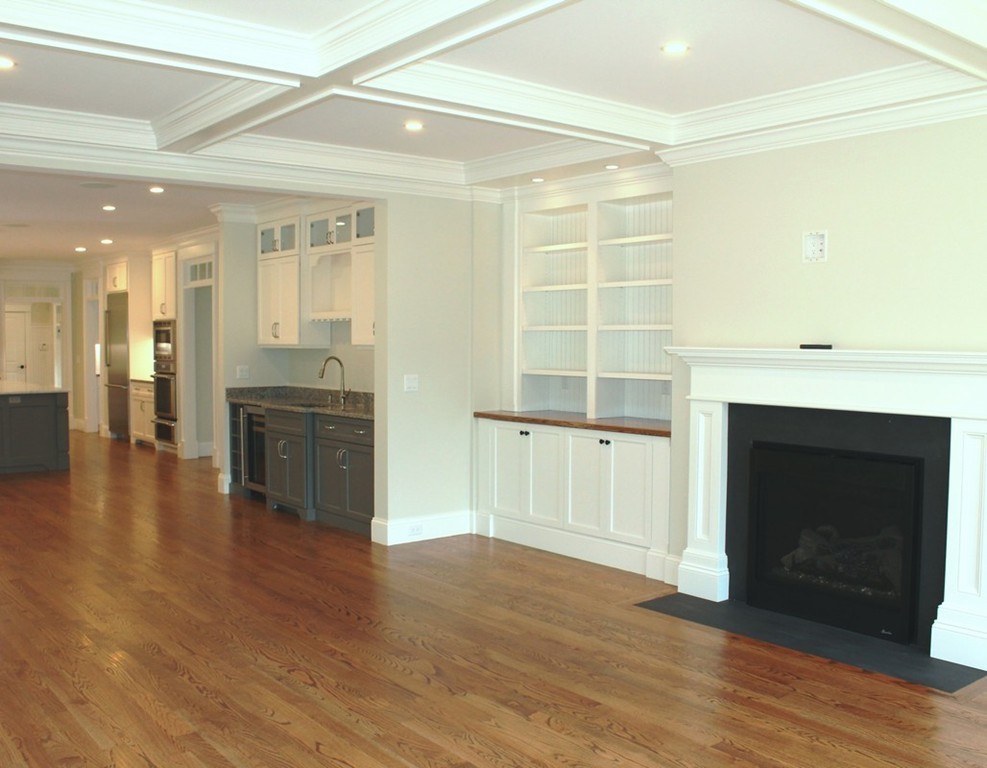 8 Burnham Road Lexington, MA 02420 - Photo 9 of 22 a view of a room with wooden floor and a fireplace