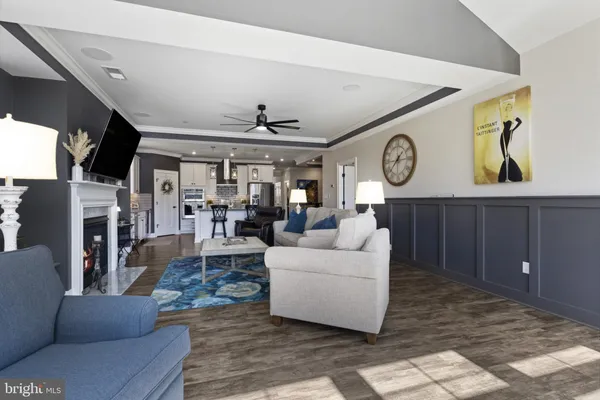 a living room with furniture and a clock