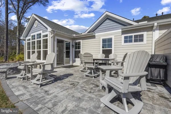a view of a dinning table and chairs in patio