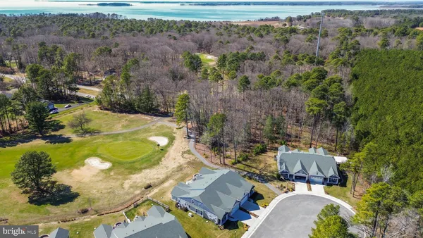 an aerial view of a house with a swimming pool